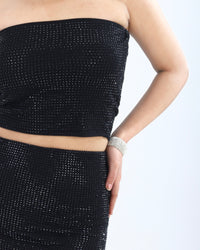 "Black sequined co-ord set for women, featuring a strapless crop top and matching mini skirt with sparkling sequins."